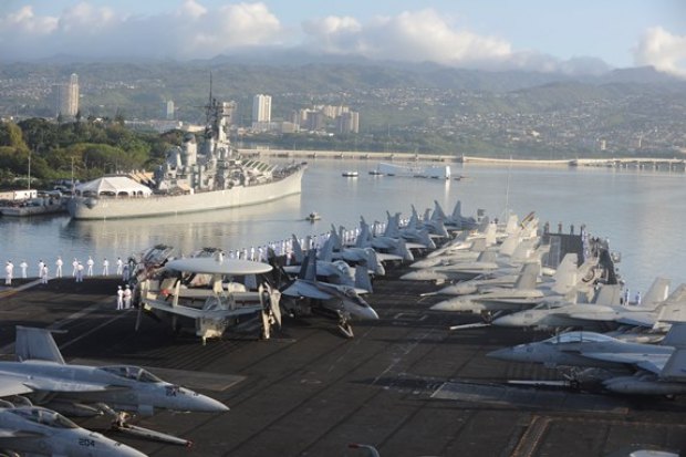 The USS Nimitz enters Pearl Harbor with NAS Lemoore FA-18s on the forward deck.